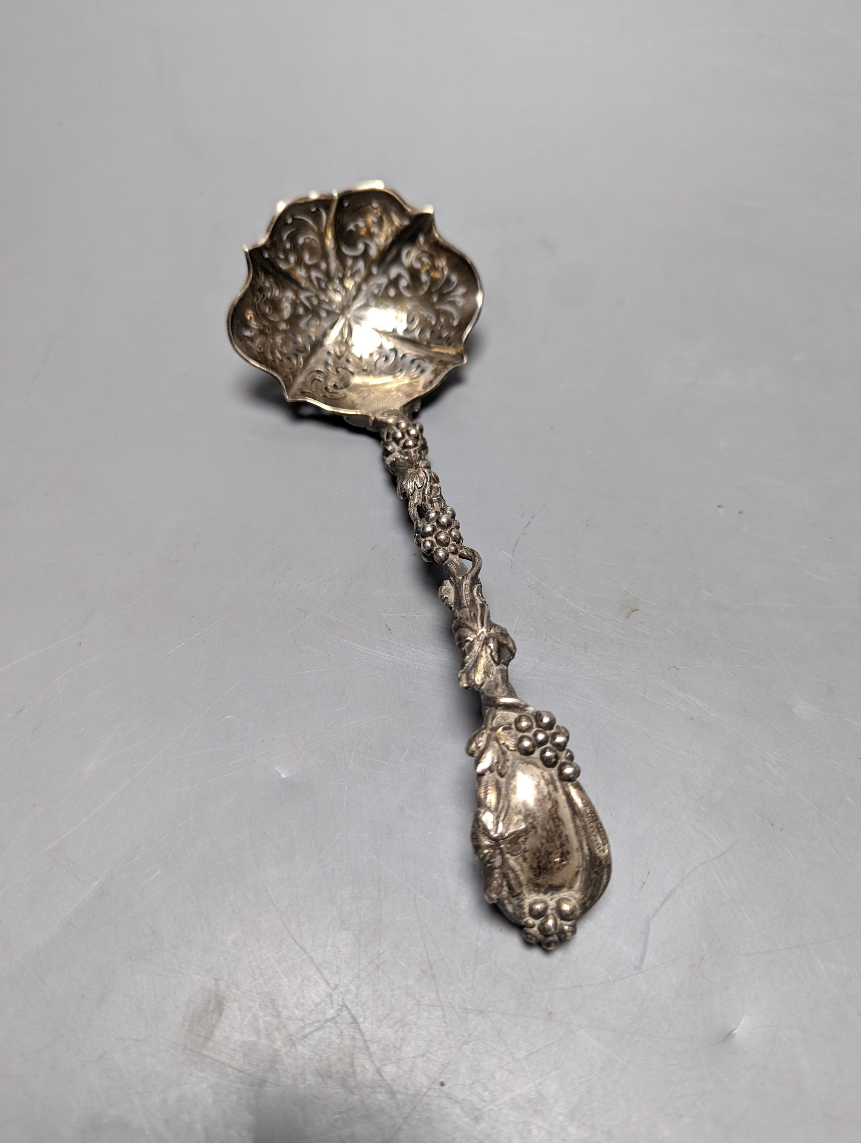 A late 19ty century Russian 84 zolotnik sifter ladle, assay master Ludvig Zug, 187?, 18.7cm, and a Victorian silver sifter spoon with vineous handle, 5oz.